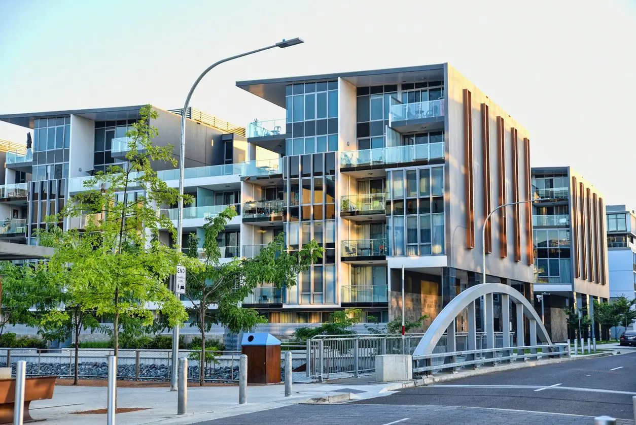 A building with many balconies on the side of it.